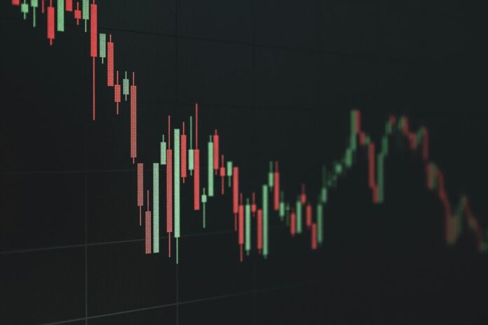 Stock market chart shows a declining trend.
