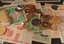a pile of foreign currency sitting on top of a table